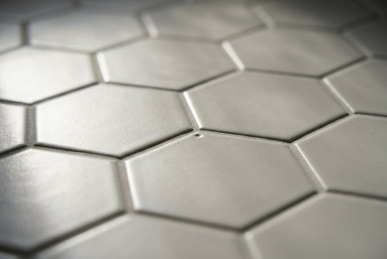 Clean gray hexagon tile floor after regrouting work